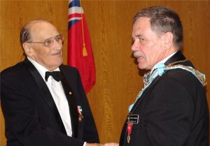 W. Bro. R. Bryson receives his 50 Years as a Past Master pin