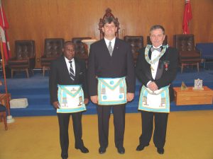 Bro. J. Caldwell with sponsor (l) W. Bro. D. Horace and W. Master P. Liukko
