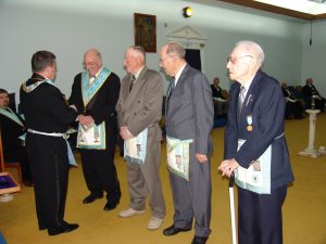 Worshipful Master P. Liukko presents pins to W. Bro. G. Boyce, Bro. J. Kallio, Bro. V. Young and Bro. O. Coley
