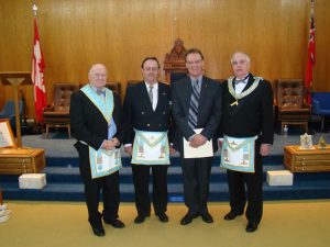 December - Bro. Mason, now a Freemason, is welcomed into Nickel Lodge by his sponsors Bro. Fransen and W. Bro. Kennedy and our Master W. Bro. Howe.