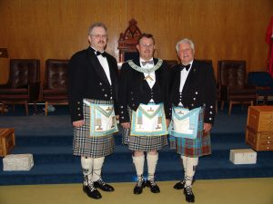 Three Kilted Brethren... (note the two Brethren on the left are wearing the Nickel Lodge Centennial Tartan).