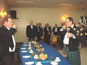 The District Deputy Grand Master's Official Visit. Our District Deputy Grand Master salutes the Piper.