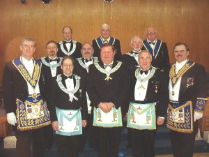 Our Distinguished East for the evening. Front row l-r: R.W. Bro. D. Bell, W. Bro. C. Gervais - Espanola Lodge No. 527, Our W.M., W. Bro. R Eaton - Doric Lodge No. 455, Our D.D.G.M. Centre row: W. Bro. R. Junkala - Sudbury Lodge No. 658, W. Bro. D. Carscallen - Bethel Lodge No. 699, W. Bro. H. Handsley - National Lodge No. 588. Back row: W. Bro. O. Koski - Friendship Lodge No. 691, V.W. Bro. R. Storie and V.W. Bro. R. Lewis - Grand Stewards.