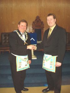 W. Bro. Luoma congratulates Bro. Mroczynski on becoming a Master Mason.