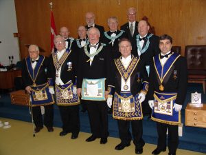The Distinguished East. Front row: V. W. Bro. J Gilpin, R.W. Bro. Ed Rennie DDGM, W. Bro. George Nichols WM, R.W. Bro. Rene Carlson DDGM Nipissing East, V.W. Bro. Art Madore Grand Steward. Middle row: W. Bro. Henry Dykalski WM Doric Lodge #455, W. Bro. Michael Chorkawy WM Bethel Lodge #699, W. Bro. Ed Patton WM Algonquin Lodge #536, W. Bro. Lyle Redden WM Friendship Lodge #691. Back row: W. Bro. Harold Saville District Secretary, R.W. Bro. J. David Innes.