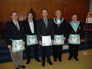 Our February Meeting - Step-Up Night. Bro. Mason (centre) was passed to the Second Degree. Pictured with Bro. Mason: W. Bro. D. Kennedy, sponsor, Bro. R. England who sat in the near East, Our Worshipful Master B. Howe and W. Bro. P. Liukko, upcoming Installing Master.