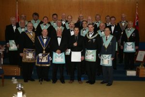 Our January Meeting - 53rd Reciprocal Visit. W.Bro. Roger Kitching and Members of Friendship Lodge No. 691 attended our Lodge on the occasion of their 53rd Visit and Initiated Mr. Justin Proulx into Masonry. Front row l to r: R.W. Bro. Robert J. Fleming; V.W. Bro. Lyle Redden; W. Bro. Roger Kitching; Bro. Justin Proulx; W. Bro. Stephen R. Fleming; Bro. Bruce Burgess. Second row: W. Bro. Ray Barlow; Bro. Ryan Lipic; Bro. Kevin Pattison; Bro. Tom King; Bro. John Robbie; Bro. John Miszczak; Bro. John Mason; W. Bro. Ben Mullins. Third row: W. Bro. Greg Newson; Bro. Mike Lalonde; Bro. Mark Woodliffe; Bro. Dan Rowe; W. Bro. George Nichols; W. Bro. Oliver Koski; Bro. John Reynolds; V.W. Bro. Robert Lewis; W. Bro. Rob Lipic; W. Bro. David Kennedy; R.W. Bro. J. David Innes.