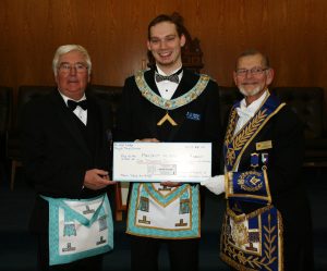 Tough Times Dinner Project Donation. On March 6th, R.W. Bro. Keith I. Jordan, D.D.G.M. made his Official Visit. The Lodge had recently held a Tough Times Dinner as a Fund Raiser for the D.D.G.M.'s Project "Feed the Hungry". The actual donation was $1300.00. L to r: Project Chairman W. Bro. Roger Kitching, W. Bro. Stephen Fleming and D.D.G.M. R.W. Bro. Keith Jordan.