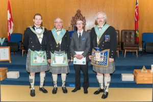 The Worshipful Master, W. Bro. Stephen Fleming, stands with sponsors Bro. Michael Lalonde, the newest Fellowcraft Bro. Johnathon Levesque and R.W. Bro. Robert J. Fleming.