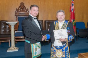 On January 19th 2016, Bro. Mark Kapitan, Secretary/Mentor Coordinator of the College of Freemasonry attended Algonquin Lodge No. 536 on the occasion of the Official Visit of R.W. Bro. Clive D. Stephenson and presented him with his certificate as a "Fellow of the College of Freemasonry".