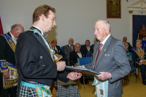 Bro. Jack Kallio, receiving his certificate from W. Bro. Stephen Fleming, W.M.
