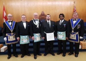 At the Regular Meeting on March 15th, Mr. Chris Daniel Carr was Initiated into Masonry. L to r: V.W. Bro. Gary R. Cayen, GJD; Bro. John Leonard, sponsor; WM R.W. Bro. J.David Innes; Bro. Chris Daniel Carr; Bro. Larry Paguandas, sponsor; V.W. Bro. Reijo Luoma, Grand Steward.