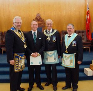 Passing of Bro. Jordan Douglas at the Emergent Meeting on June 15th. L to r: Sponsor R.W. Bro. Robert J. Fleming; Bro. Jordan Douglas; WM R.W. Bro. J. David Innes; Sponsor W. Bro. Paavo Liukko.