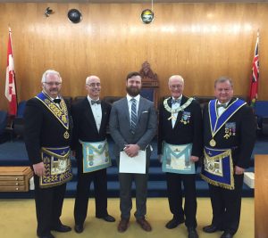 At the Regular Meeting in December, Mr. Jordan Tizzard was Initiated into Masonry. L to r: Sponsors R.W. Bro. Rob Fleming and Bro. John Reynolds, Bro. Jordan Tizzard, WM R.W. Bro. J. David Innes, Grand Steward V.W. Bro. Reijo Luoma.
