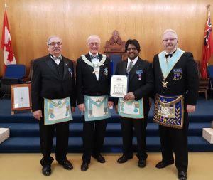 Bro. Larry Paguandas presented with his Grand Lodge Certificate. L to r: Bro. Michael Lalonde, sponsor; WM R.W. Bro. J. David Innes; Bro. Larry Paguandas; R.W. Bro. Robert J. Fleming, sponsor.