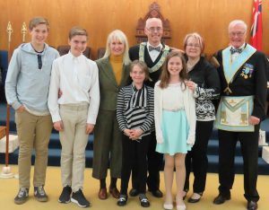 Installation of Bro. John Michael Reynolds on May 6th 2017. The newly installed W. Bro. John M. Reynolds called the Lodge from Labour to Refreshment and members of his family were invited in. His mother Shelley del Bosco presented him with his gavel. Front row: daughters Mia and Annikka. Second row: family friend Malcolm Macko, son Matti, Shelly del Bosco (sister of R.W. Bro. J.D. Innes), W. Bro. John M. Reynolds, wife Paula Reynolds, uncle R.W. Bro. J. David Innes.